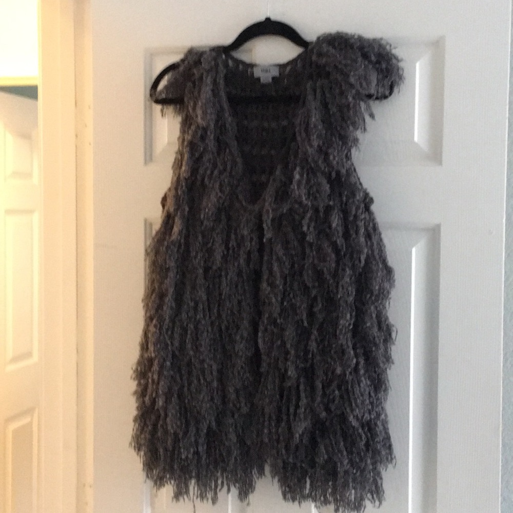 Gray sweater vest.
